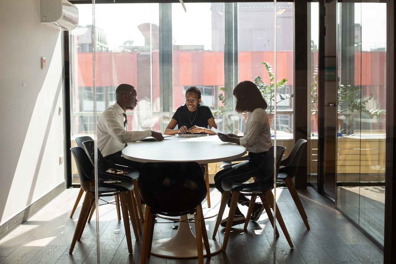 Group of employees collaborating in meeting room